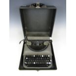A vintage Remington Rand typewriter and case