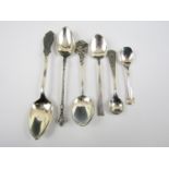 A quantity of sterling and continental silver spoons including salt and coffee spoons and a 'St