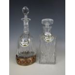 Whiskey and sherry decanters with bottle tags and an electroplate coaster stand