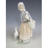 A Lladro figurine of a young girl with geese (a/f)