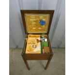 A vintage sewing box / table with contents (a/f)