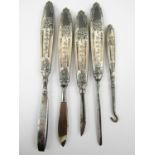 A set of late 19th / early 20th Century white metal mounted manicure items