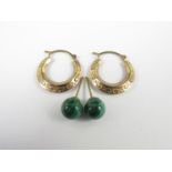 A pair of yellow metal half hoop earrings together with a pair of malachite stud earrings, 1.2g