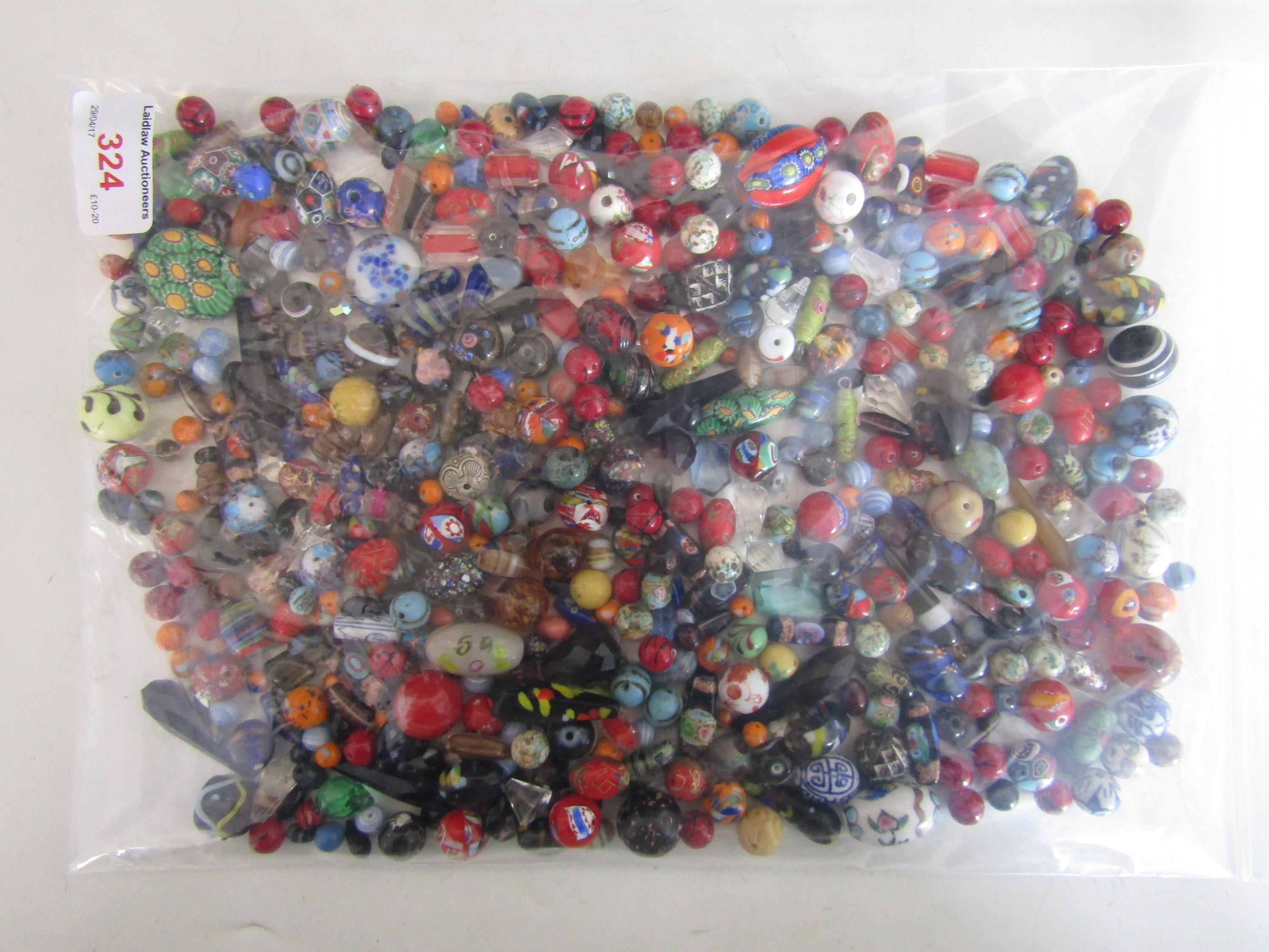 A large quantity of vintage glass and composition lampwork and other beads in tones of red, black