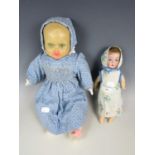 Two vintage dolls, one with a bisque head and fixed glass eyes