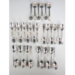 Five sets (four sets of six and one set of nine) electroplate coffee spoons including Onedia,