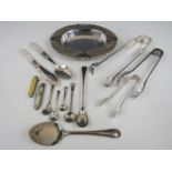An electroplate dish together with a quantity of cutlery including sugar and ice tongs and a fruit