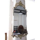 A contemporary ornate wall mirror, 104 x 46 cm