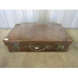 A large vintage leather luggage case