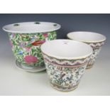 A large Chinese Famille Rose planter and stand together with two others