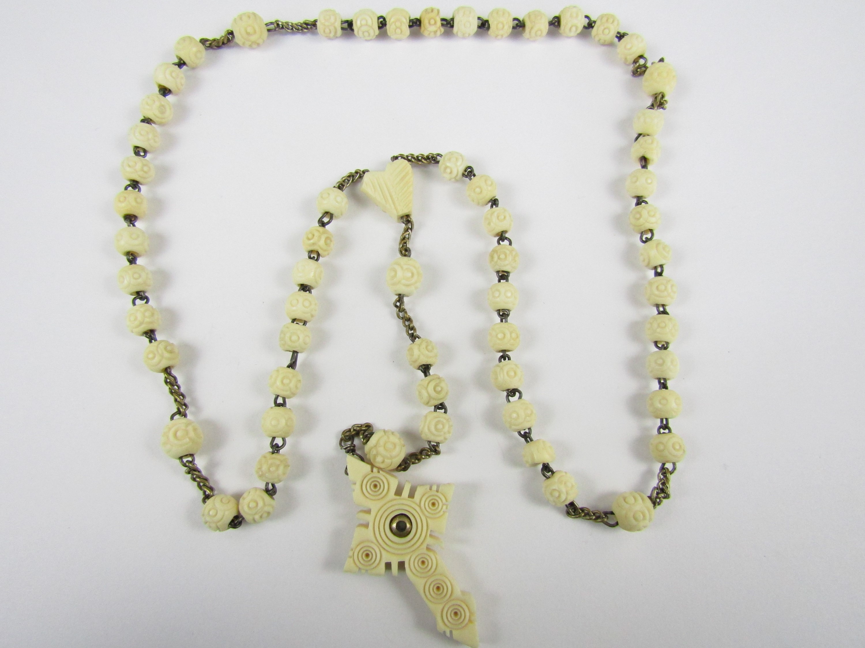 An early 20th Century bone Rosary bead necklace with Stanhope view the 'Nativitie'