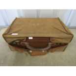 A vintage leather vanity case with dust cover