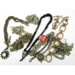 A quantity of vintage watch chains including silver examples and sundry fobs