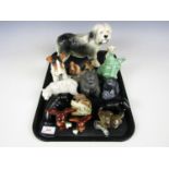 A large quantity of animal figurines including dogs, a polar bear and a walrus etc.