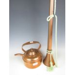 A copper hunting horn together with a copper kettle