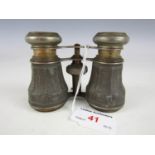 A pair of 19th Century opera glasses with carved decoration to the body