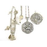 A vintage white metal charm bracelet together with two white metal pendants etc, 46.1g total weight