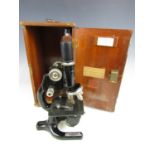 A vintage Hawkesley and Sons of London microscope in a fitted wooden case