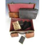 A vintage travel case containing a collection of vintage purses etc, including a handmade coal