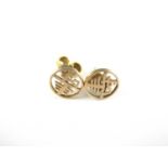 A pair of Chinese yellow metal character stud earrings, 1g