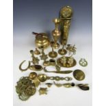 A large quantity of vintage brass ware including a kettle, a vase and horse brasses etc.