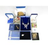 Vintage and modern cased costume jewellery, including a Swarovski crystal brooch in the form of a