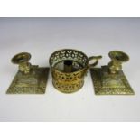 A pair of 19th Century cast brass diminutive candlesticks together with a brass chamberstick