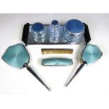 Vintage dressing table items, including three cosmetic bottles with guilloche engraved and