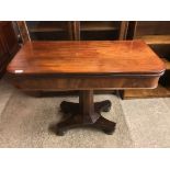 A second quarter 19th Century mahogany turn over top tea table