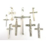 Eight vintage silver and white metal cruciform pendants, test as silver, 14.6g total