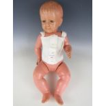 A 1920s Sekiguchi Corp type celluloid baby boy doll, with painted eyes and cherry blossom and