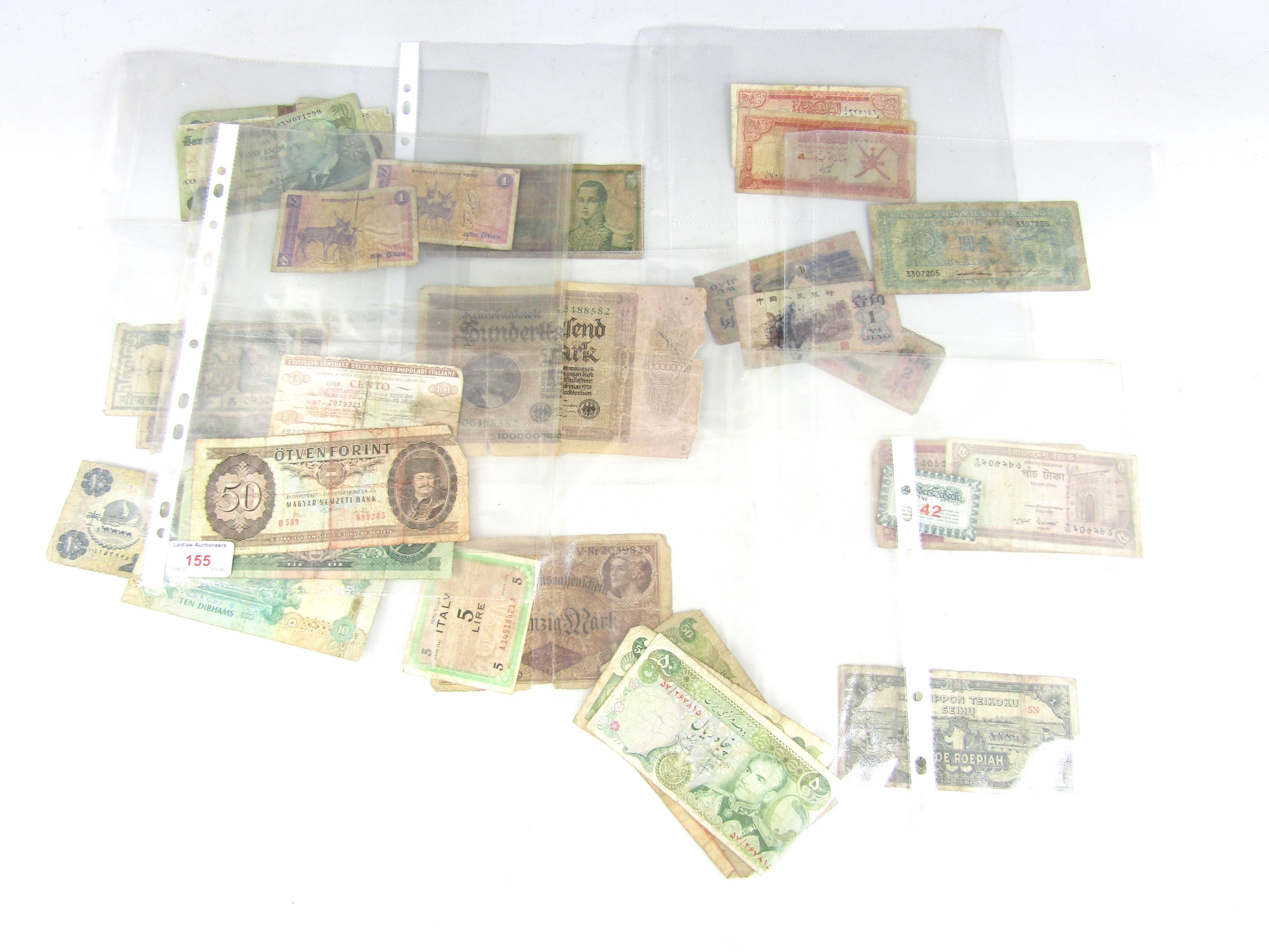 Iranian bank notes together with Japanese bank notes etc.