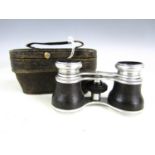 A vintage pair of cased opera glasses