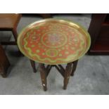 An Indian brass tray topped table