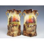 A pair of late 19th Century earthenware vases, transfer printed in depiction of cattle and horses