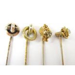 Victorian and Edwardian rolled gold and gilt metal stick pins, with knotted and paste set terminals