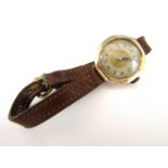 An early 20th lady's 9ct gold cased wristwatch, with silvered chapter and Arabic numerals