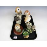 Seven owl figurines