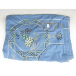 A 1930's hand embroidered bedspread decorated with chain stitched silk threads over cornflower