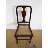 A cane seated bedroom chair