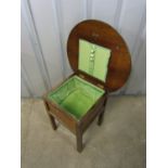 A vintage oak sewing box table