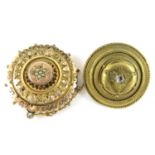 A Victorian Etruscan Revival rolled-gold boss brooch, centrally set with split seed pearls, together