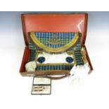 A vintage Masonic case containing a medallion and regalia