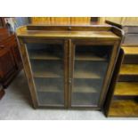 A 1920's glazed oak bookcase, 92 x 25 x 107 cm