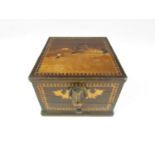 A vintage marquetry inlaid cigarette box with naive dog mask handle