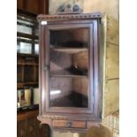 A Victorian mahogany hanging corner cupboard