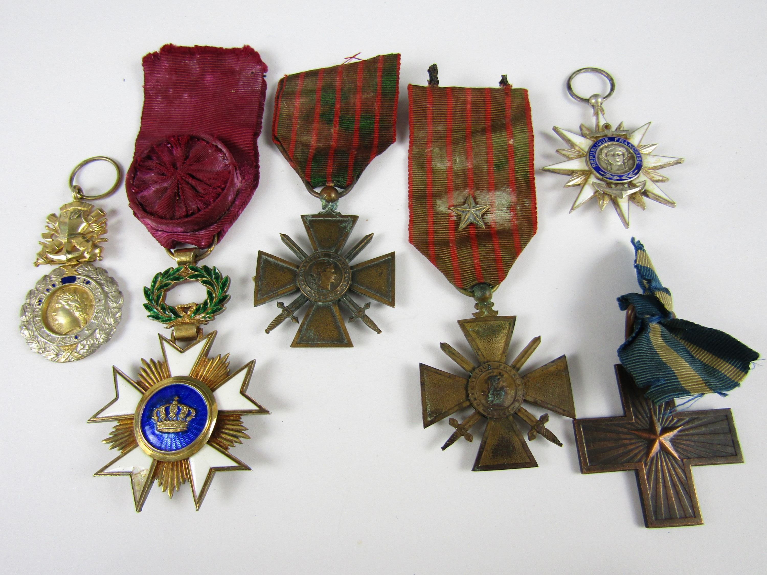 A Belgian Order of the Crown, French Order of Maritime Merit, three other French military medals and