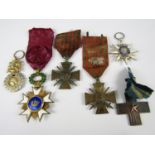 A Belgian Order of the Crown, French Order of Maritime Merit, three other French military medals and