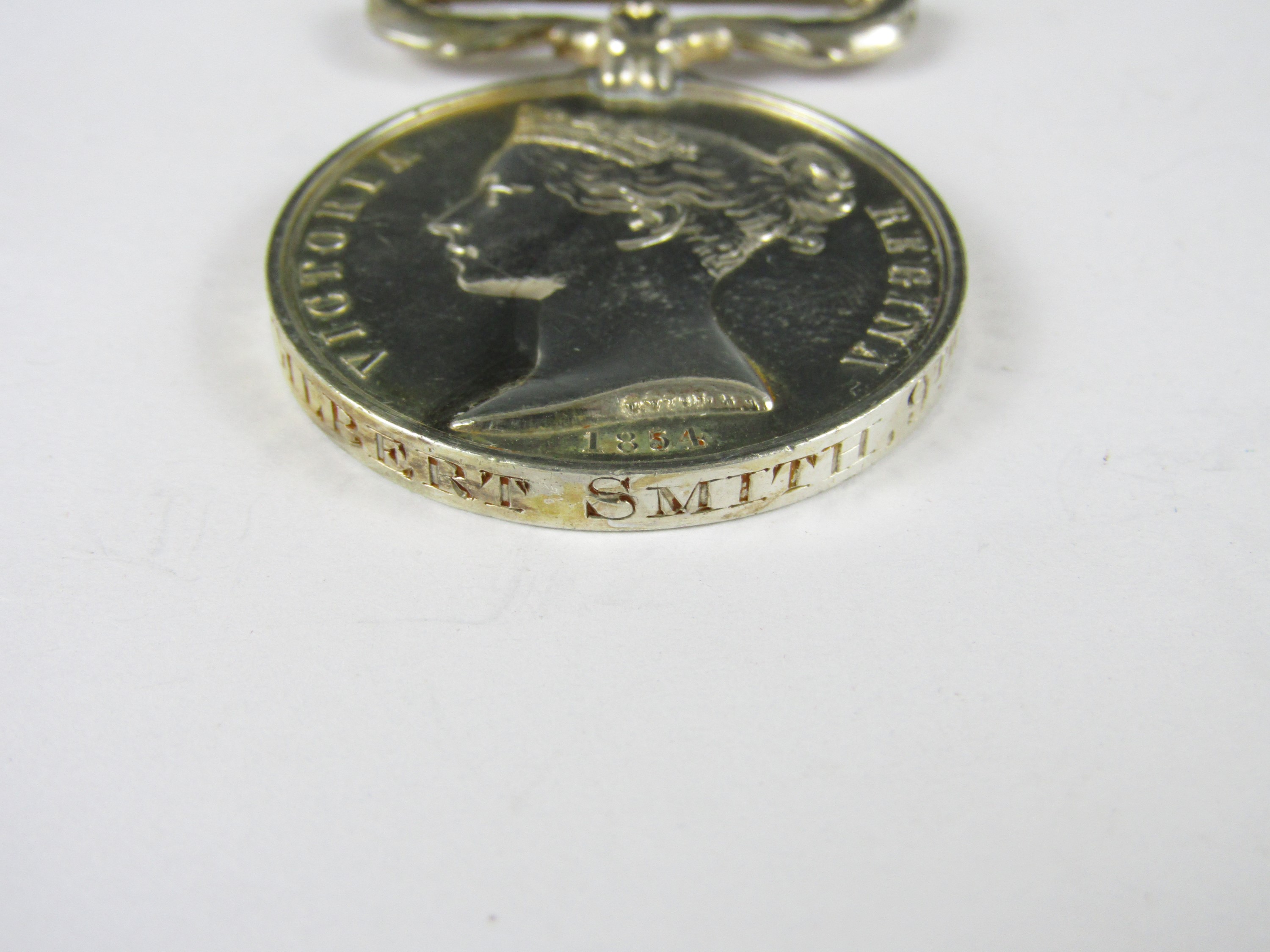 A Crimea Medal with loose Sebastopol clasp engraved to PRIE Gilbert Smith, 9th Foot - Image 2 of 2