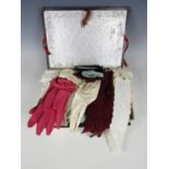 A 1930s chocolate box containing a large quantity of handkerchiefs and day gloves